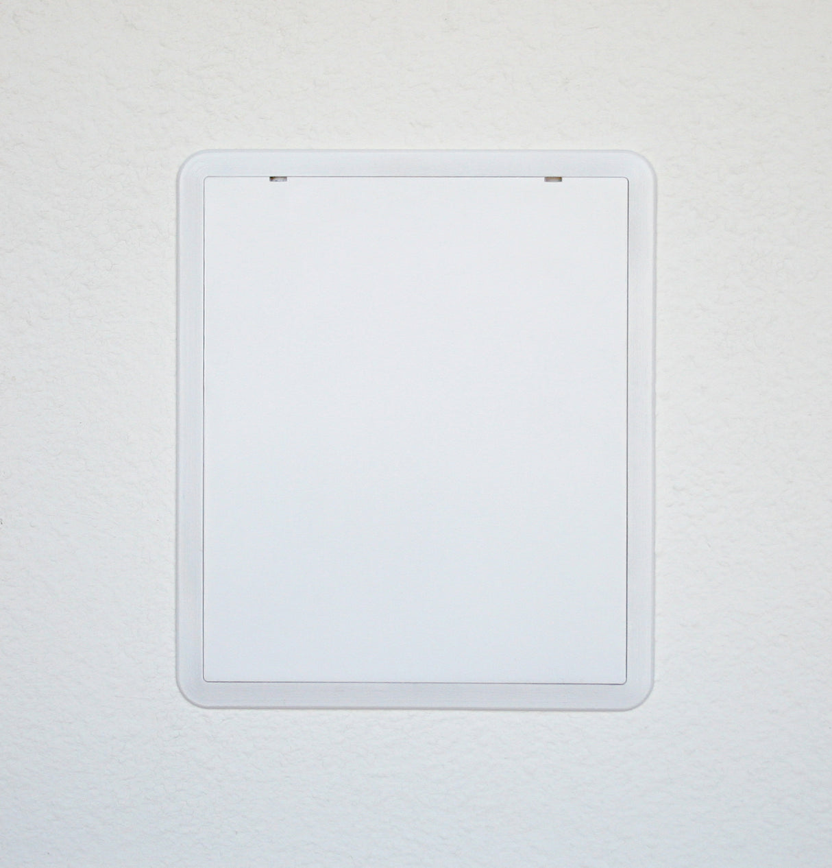 Finished installation with front cover. Can be painted with non-metallic paint to match the wall color.